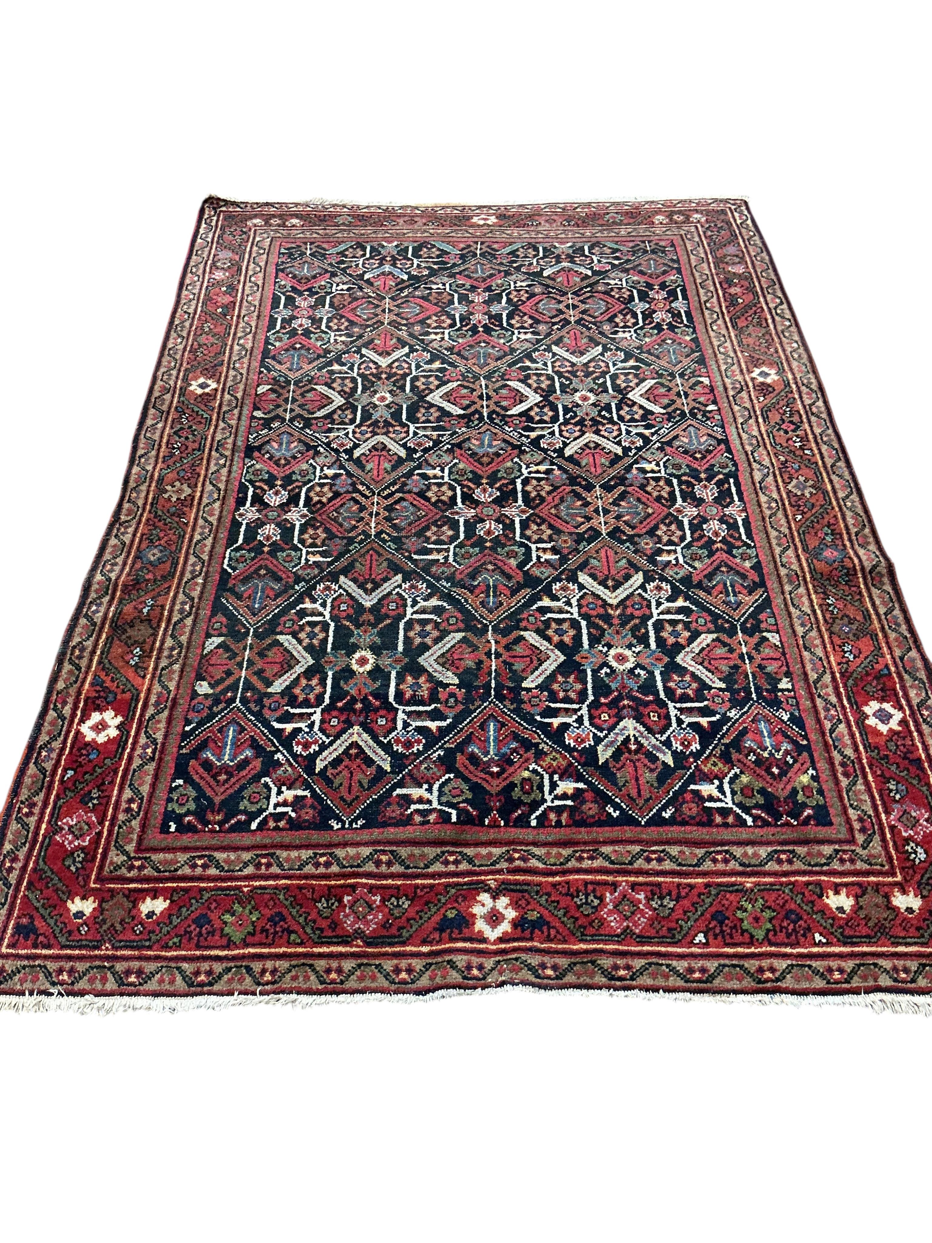 A North West Persian blue ground geometric rug, 210 x 140cm